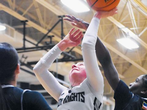 Senior Abby Wehr (3) manuevers past the outstretched hand of Andrews' Juliet Holloway for a first-half basket attempt Tuesday. Photo by Kevin Hensley/sports@grahamstar.com