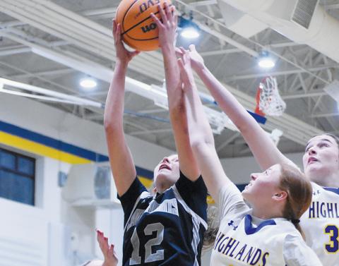 Zaelyn Phillips pulls down one of her team-best 12 rebounds during Jan. 8's overtime, road victory against Highlands. Photo by Kevin Hensley/sports@grahamstar.com