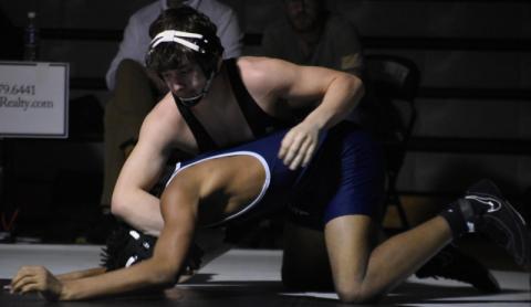 Lleyton Hooper maintains top control on Bonnie Cone Leadership Academy's Malachi Smith during Feb. 10's second-round, dual-team postseason match. Lleyton is 1-of-4 Black Knights that will vie for an individual state championship Saturday in Greensboro. Photo by Kevin Hensley/sports@grahamstar.com
