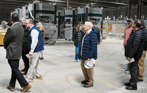 Local and regional officials explore the progress made inside EcoKing Solutions' renovated facility off Snowbird Road on Feb. 12. Photos by Kevin Hensley/editor@grahamstar.com