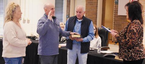 Newly-appointed Graham County Sheriff Russell Moody (left) is administered the oath of office by Graham County Clerk of Court Tammy Holloway on Tuesday. Moody was selected Monday by the Graham County Board of Commissioners to temporarily fill the vacancy left by the suspension of Brad Hoxit on Jan. 29. Photo by Kevin Hensley/editor@grahamstar.com
