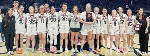The Robbinsville Lady Knights gather with the 1A state runner-up plaque Wednesday, just minutes after falling 58-44 in the title game to Wilson Preparatory Academy. Photo by Kevin Hensley/sports@grahamstar.com