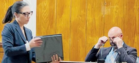 District Attorney Ashley Welch departs from the witness stand after questioning Brad Hoxit about the contents of a three-ring binder at a hearing to determine the permanent removal of Hoxit as Graham County Sheriff on March 27. Photos by Kevin Hensley/editor@grahamstar.com