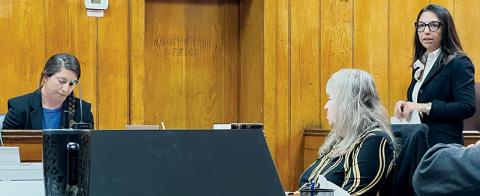 District Attorney Ashley Welch (right) questions North Carolina Department of Insurance Special Agent Jasmine Hanline (left, in witness box) during Tuesday's session of a hearing regarding the removal of Graham County Sheriff Brad Hoxit from office. Photos by Kevin Hensley/editor@grahamstar.com