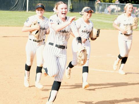 Lady Knights sophomore Daphne Barlow was elated as she sprinted to the dugout after completing the first and second legs of a 6-3 triple play Friday against Swain County. Photo by Kevin Hensley/sports@grahamstar.com