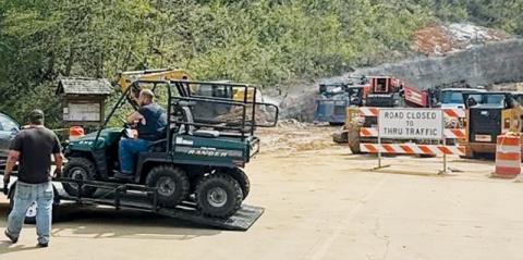 Members of Graham County Fire and Rescue unload a side-by-side to aid in a rescue operation at Stecoah Gap on Saturday. Photo courtesy of Graham County Fire and Rescue
