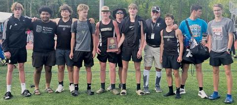 The Robbinsville Black Knights proudly display the 1A Western Regional Championship plaque Friday, after conquering the competition at Montreat College.