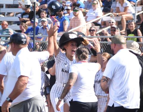 Adorned with the Lady Knights' "Home Run Hat," Robbinsville senior Anna Williams celebrates after hitting a grand slam in the first inning of Friday's state-championship series opener. Williams finished the game with six RBIs. Photo by Kevin Hensley/editor@grahamstar.com