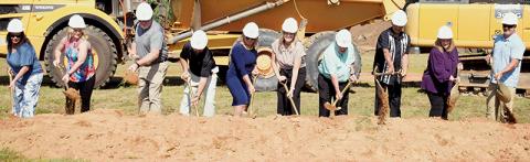 Officials from across Graham County participate in the ceremonial groundbreaking of the new Robbinsville Elementary School on July 1. Photo by Kevin Hensley/editor@grahamstar.com