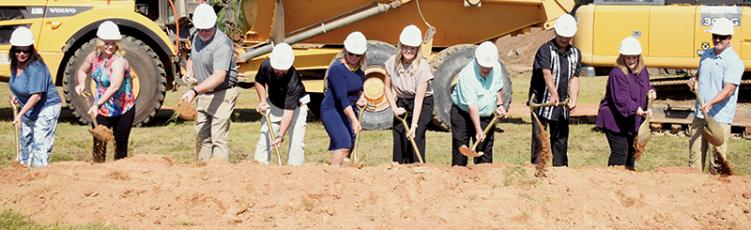 Officials from across Graham County participate in the ceremonial groundbreaking of the new Robbinsville Elementary School on July 1. Photo by Kevin Hensley/editor@grahamstar.com