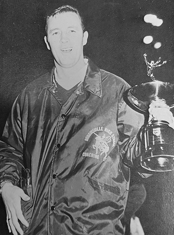 This iconic photo of Bob Colvin celebrating with the 1969 1A state championship trophy – the first in  Robbinsville history – was selected as the cover of The Graham Star’s 2017 publication, Title Town.
