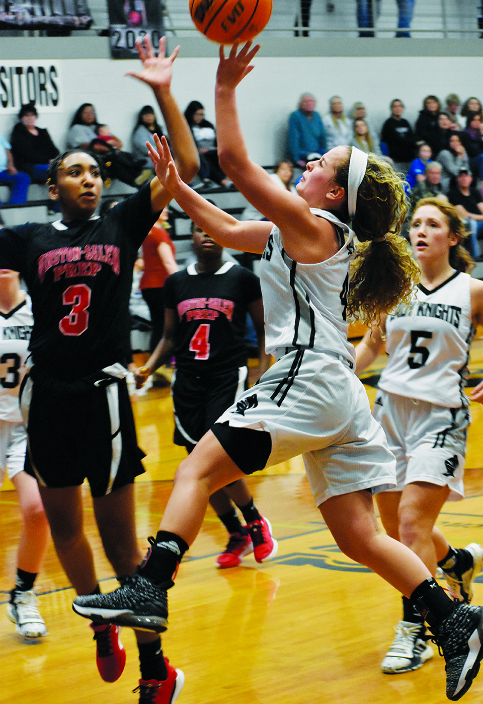 Robbinsville’s Desta Trammell takes flight during the first-half of Tuesday’s home playoff game against Winston-Salem Prep. Trammell led the Lady Knights with 15 points in the win. Photo by Kevin Hensley/editor@grahamstar.com