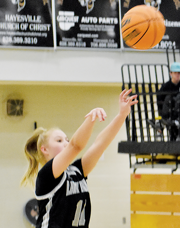 Suri Watty unleashes one of her four, 3-pointers Tuesday at Hayesville.