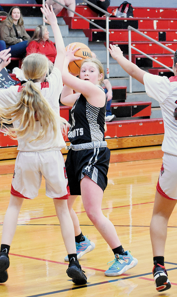 Novie Dutcher searches for open personnel during the JV girls opener Feb. 2 in Andrews.