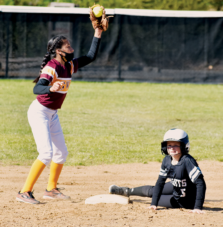 Robbinsville Middle School’s Ella Atwell (5) checks with head coach Anna Stewart after sliding safely into second on a double during Friday’s home game against Cherokee. Photo by Kevin Hensley/editor@grahamstar.com