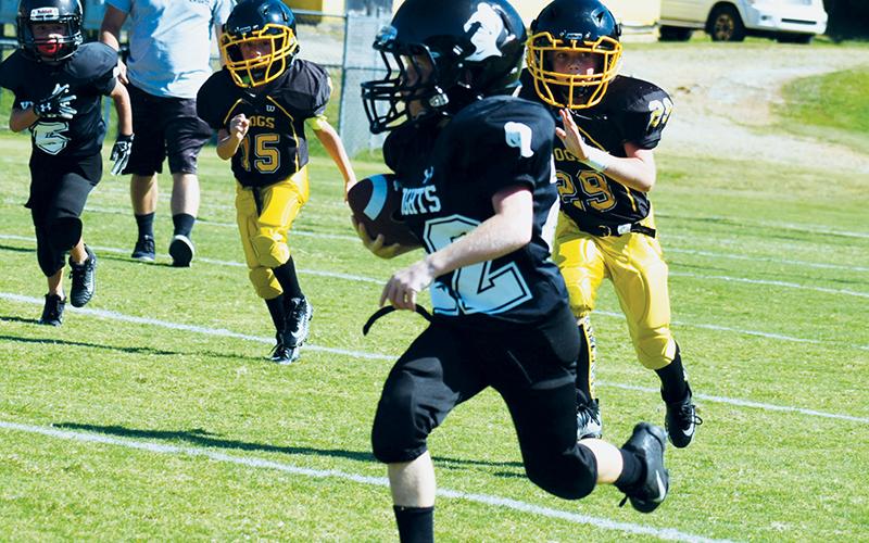 Conner Hyde finds some real estate during PeeWee action at Murphy on Saturday. Photo by Jenny Millsaps