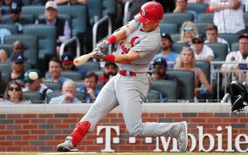 St. Louis Cardinals’ Tommy Edman doubles to score teammates Marcell Ozuna and Yadier Molina during the first inning of Game 5 of the National League Division Series baseball game against the Atlanta Braves on Wednesday in Atlanta. John Bazemore/Associated Press