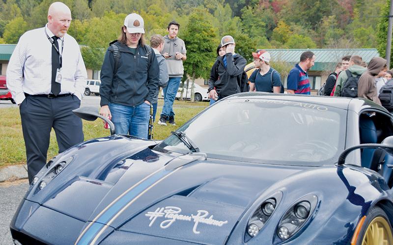 Robbinsville High School principal David Matheson (left) and senior Christopher Shope behold a Pagani automobile that visited the campus Oct. 16. Photos by Art Miller/amiller@grahamstar.com
