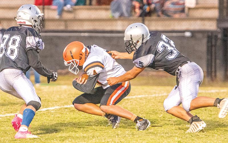 Junior varsity Black Knights Brock Adams (88) and Anjalo Fierro (32) close in on a Rosman runner during the Oct. 17 season finale. Photo by Byron Housley/The Graham Star