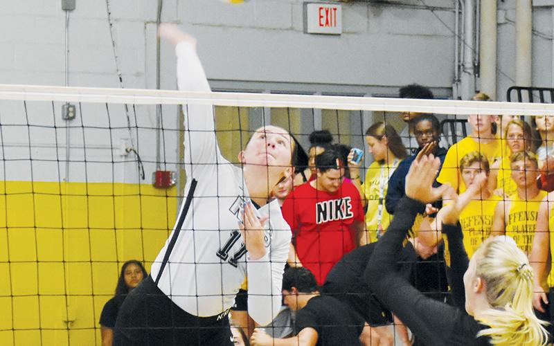 Robbinsville senior Karlyn Matheson prepares to drive one of her team-leading 29 kills onto the Murphy side of the net during Oct. 3’s road match. Photo by Noah Shatzer/Cherokee Scout