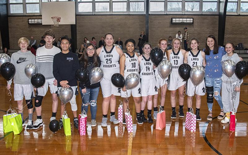 The Robbinsville Middle School eighth-grade basketball players were recognized at Monday’s game against Cullowhee Valley. From left are Zeke Silvers, Donovan Carpenter, Xander Wachacha, Tylie Bridges, Aubrie Wachacha, Noelle Orr, Emma Beasley, Zoie Shuler, Karlee Stewart, Memory Frapp, Linsey Orr and Taelyr Jackson. Photo by Byron Housley/The Graham Star