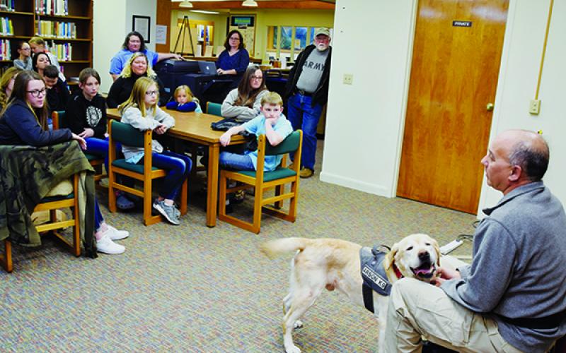 Dean Castaldo and his arson companion Dante (right) present a Fire Prevention Class at the Graham County Public Library on Monday. Photo by Art Miller/amiller@grahamstar.com
