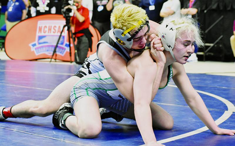 Luke Wilson maintains top control on Uwharrie Charter’s Heaven Fitch during the 106-pound state finals Saturday night in Greensboro. Photos by Kevin Hensley/editor@grahamstar.com