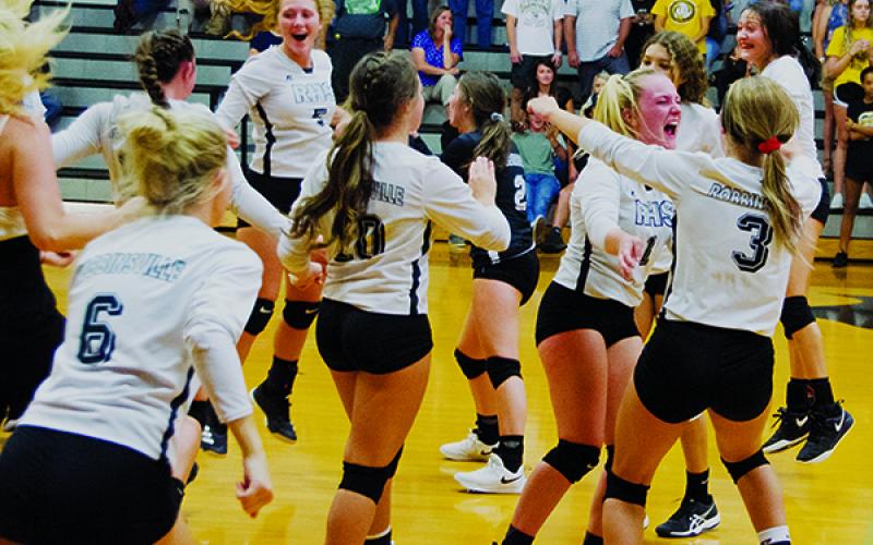 Jubilation sets in for the Robbinsvlle Lady Knights, moments after a thrilling 5-set victory over Murphy on Sept. 5. It was the first win for Robbinsville over the Lady Bulldogs since 2015. Photo by Kevin Hensley/editor@grahamstar.com