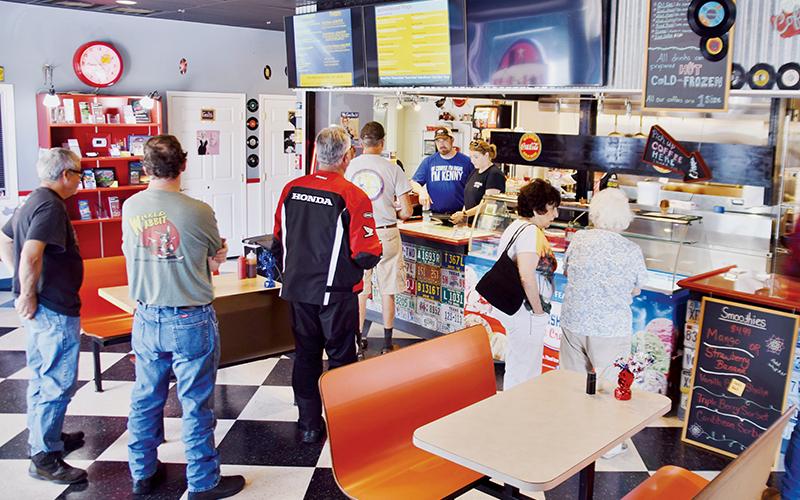 Customers eagerly await their food at The Hub on Saturday. Photos by Art Miller/amiller@grahamstar.com