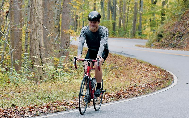 Fontana Dam resident Jon Hodgson was all smiles Monday morning, as he trekked up N.C. 28 to begin the second portion of a triathlon. Photos by Kevin Hensley/editor@grahamstar.com