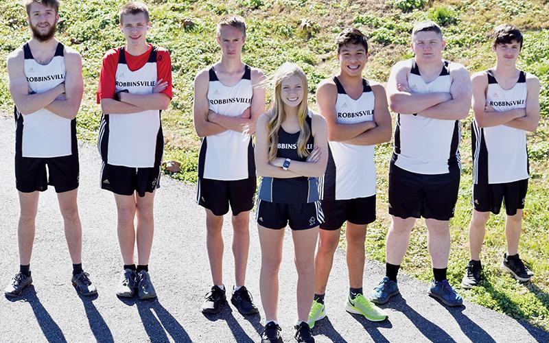 The 2020-21 Robbinsville High School cross-country team consists of (from left): Sully Shanahan, Zeb Stewart, William Cable, Ava Barlow, Xander Wachacha, Phoenix Brooks and Hayden Stewart. Photo by Kevin Hensley/editor@grahamstar.com