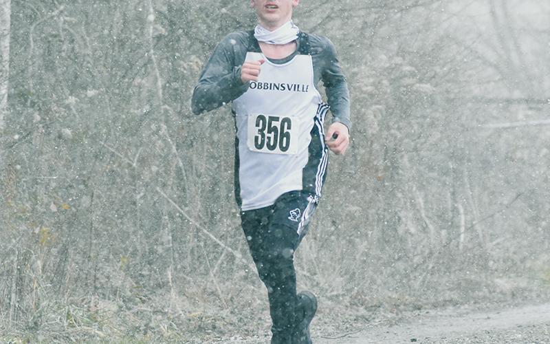 Members of the Robbinsville cross country team – including sophomore Hayden Stewart – had to deal with heavy snowfall and sub-freezing temperatures to  compete in Saturday's 1A Western Regional Meet in Bryson City. Photos by Kevin Hensley/editor@grahamstar.com