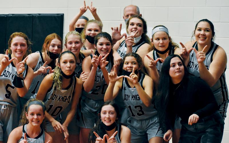 In the moments following Robbinsville’s 67-53 win over Murphy on Tuesday night, it was tough for the Lady Knights to know exactly which camera to look at, as multiple sources attempted to capture the first post-game memory of the victory. Photos by Kevin Hensley/editor@grahamstar.com