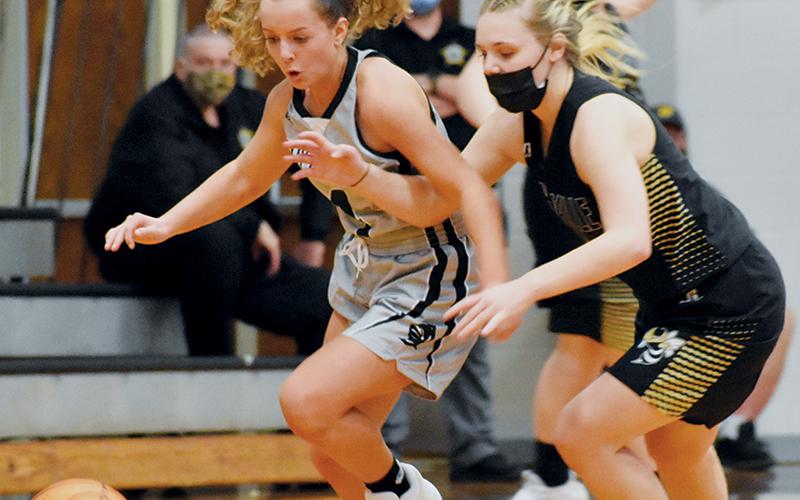 Moments after swatting the ball away Jan. 20 against Hayesville, Robbinsville’s Desta Trammell eyes a steal.