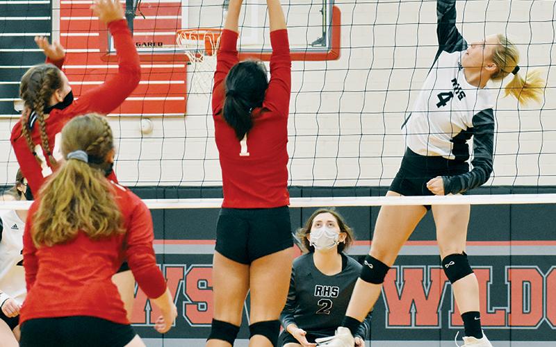 Kensley Phillips shows off her vertical prowess while rising for the kill Monday at Andrews. Photos by Kevin Hensley/editor@grahamstar.com