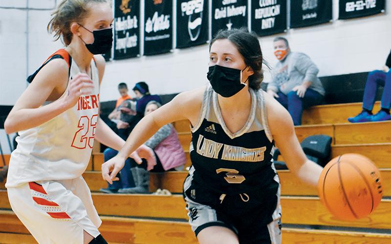 Gabby Hooper cuts around Rosman’s Alissa Cheek on a drive to the basket Friday at Rosman. Hooper finished the game with 15 points. Photos by Kevin Hensley/editor@grahamstar.com