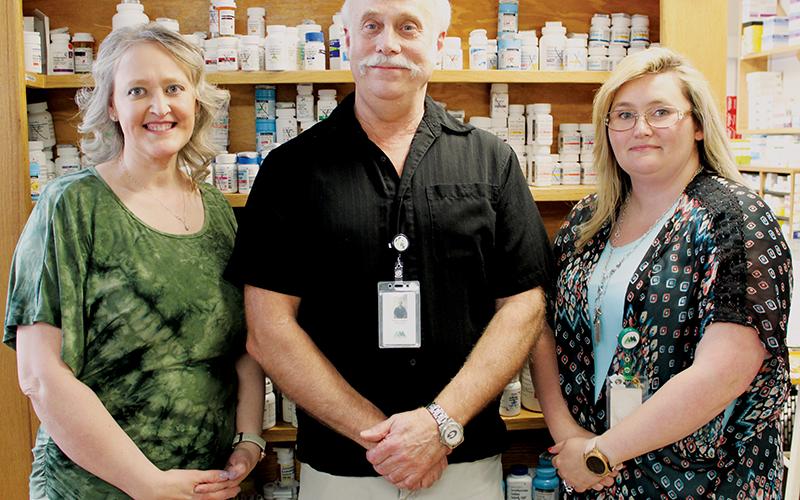 Pharmacy technician Tammy Creasman, pharmacist David Mosteller and certified pharmacy technician Tonya Howell (from left), in their workspace at the Tallulah Pharmacy, located inside the Tallulah Health Center. Not pictured is certified pharmacy technician Lacy Hamilton. Photos by Charlie Benton/news@grahamstar.com