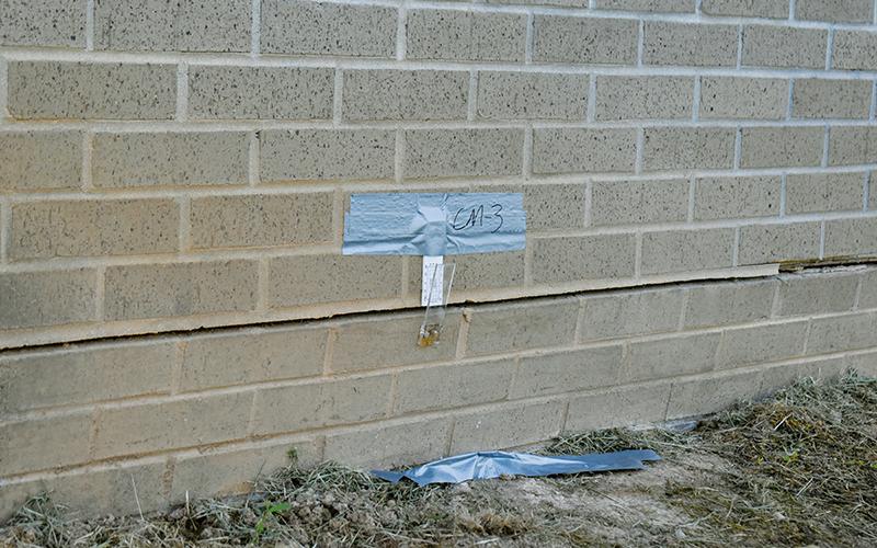 A crack monitor measures the expansion around the foundation of Robbinsville Elementary School’s gymnasium. The facility has been closed since late February, when Graham County School officials began to notice the floor was beginning to shift. Photos by Kevin Hensley/editor@grahamstar.com
