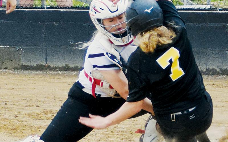 Senior catcher Maggie Knight tags out South Stokes’ Madison Wilson during the May 5 first-round playoff game against the Sauras. Robbinsville fell 3-0, to be eliminated from the postseason. Photo by Art Miller/amiller@grahamstar.com