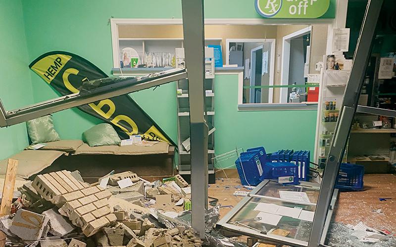 Bobby Kays has been accused of using a Graham County Sheriff’s Office vehicle to run through the front of Robbinsville Pharmacy on Saturday night. After the incident, the damaged portion was boarded up with plywood and the pharmacy reopened Monday. Photo courtesy of Robbinsville Pharmacy