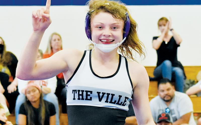 Aynsley Fink shows off a battle wound Saturday, moments after capturing the N.C. High School Athletic Association’s 106-pound championship at the Women’s Invitational in Kernersville. Photo by Kevin Hensley/sports@grahamstar.com