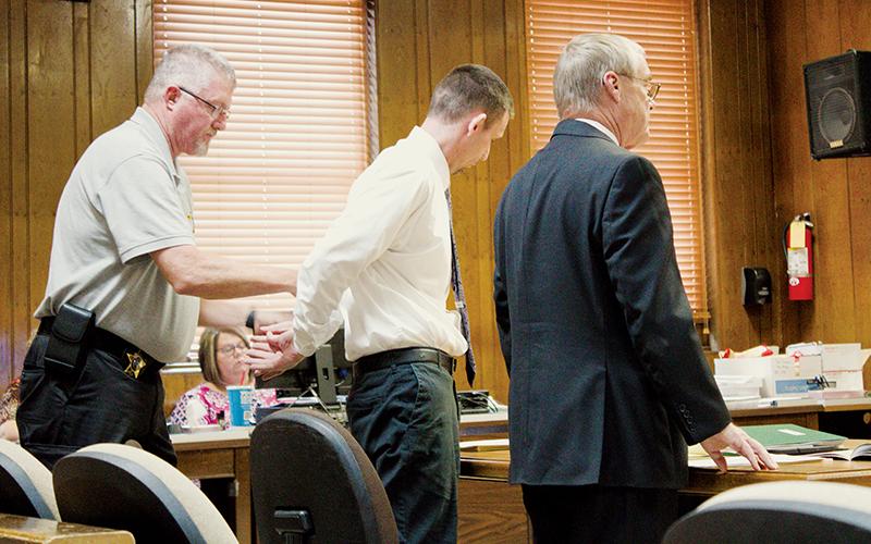 Casey Adam Haney is taken into custody after being found guilty on two counts of indecent liberties with a child, and one count of statutory rape Friday, following a nearly two-week trial. Photo by Charlie Benton/news@grahamstar.com