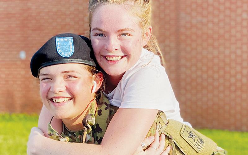 The family bond has always been special for Robbinsville High School senior Ainslee Munro. As such, she was elated to be reunited with her family after completing basic training over the summer – especially with her sister Baeleigh.