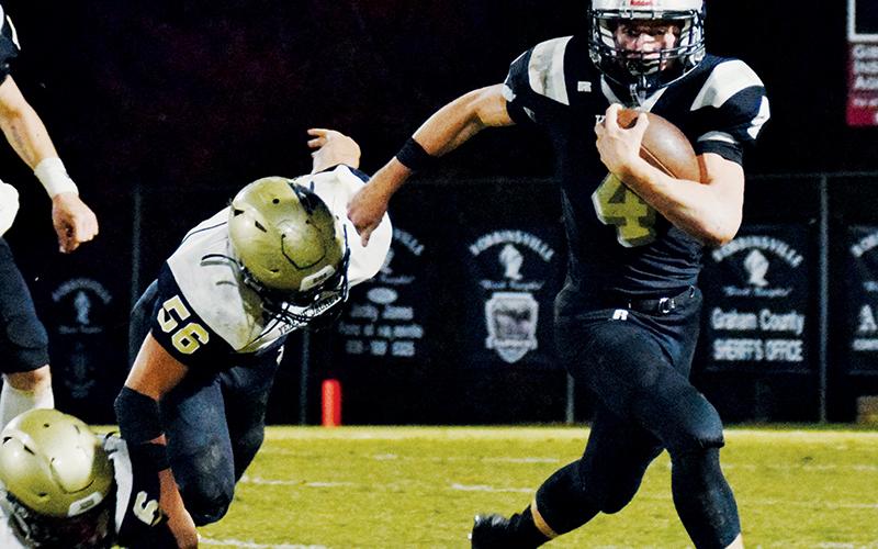 Cuttler Adams (4) leaves Hayesville’s Cameron Payne laying during Friday’s regular-season finale against Hayesville. Through eight games of his sophomore campaign, Adams has amassed 1,253 rushing yards and has found the end zone on 14 different occasions. Photos by Art Miller/amiller@grahamstar.com