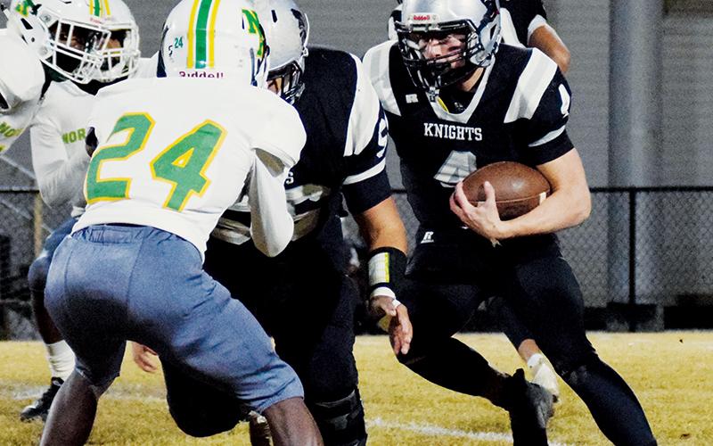 Cuttler Adams maneuvers through the North Rowan defense on Friday. Adams broke the Robbinsville High School rushing record for a single game in the victory, charging to 377 yards and four touchdowns. Photo by Art Miller/amiller@grahamstar.com