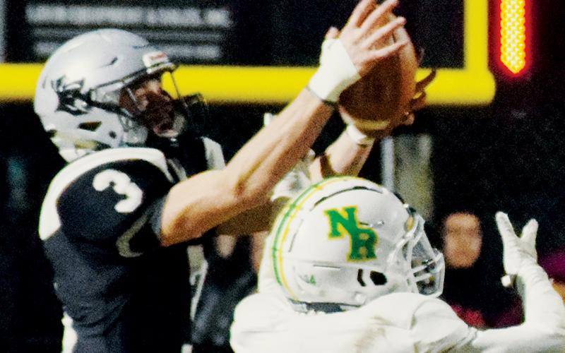 Robbinsville senior Isaac Wiggins picks off a second-half pass intended for North Rowan’s Jerome Blakeney on Friday.