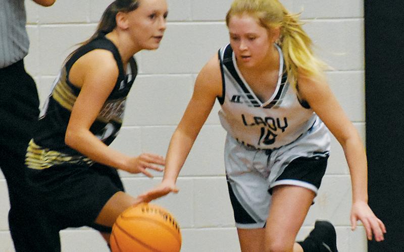 Middle school Lady Knight Novie Dutcher (15) breaks away from the Hayesville defense during Monday’s game. Photos by Kevin Hensley/sports@grahamstar.com