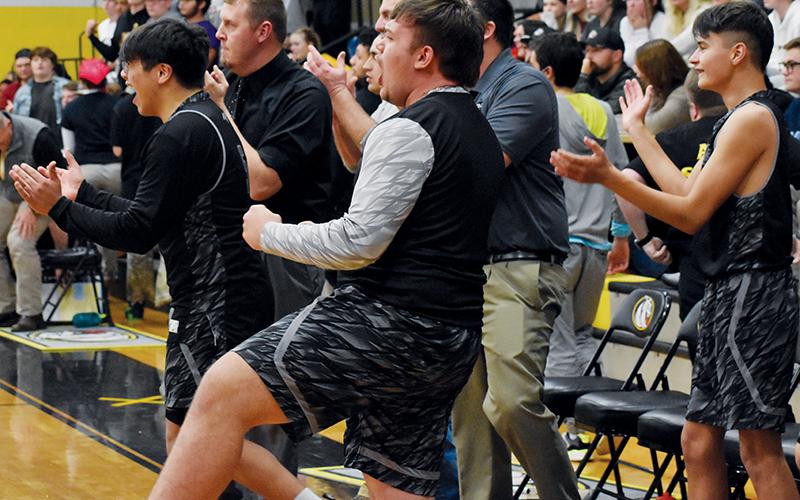 Members of the Robbinsville Black Knights erupt in celebration at the final buzzer Tuesday, which cemented a 68-64 Robbinsville victory at Murphy. Photos by Kevin Hensley/sports@grahamstar.com