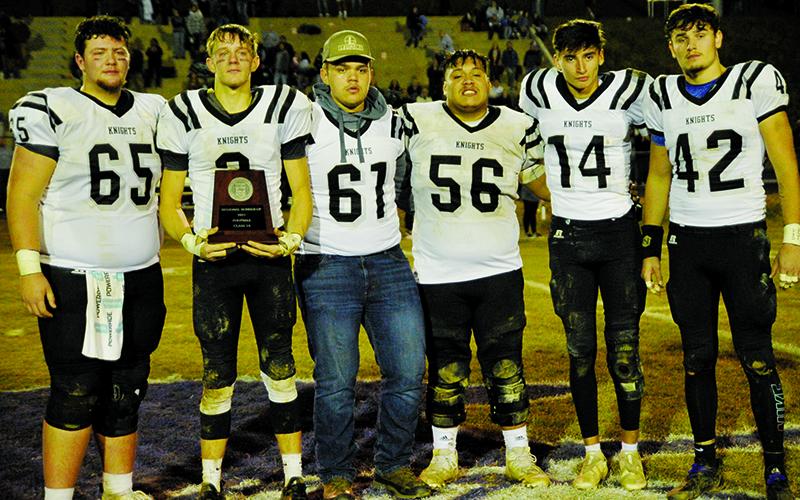 An emotional group of Black Knights accept the N.C. High School Athletic Association’s 1A Western Regional runner-up plaque Friday night at Mitchell High School. From left are Carson White, Isaac Wiggins, Drake Hill, Carlos Wesley, Dasan Gross and Eddie Brooms. Photo by Zack Colburn/ZWCSports