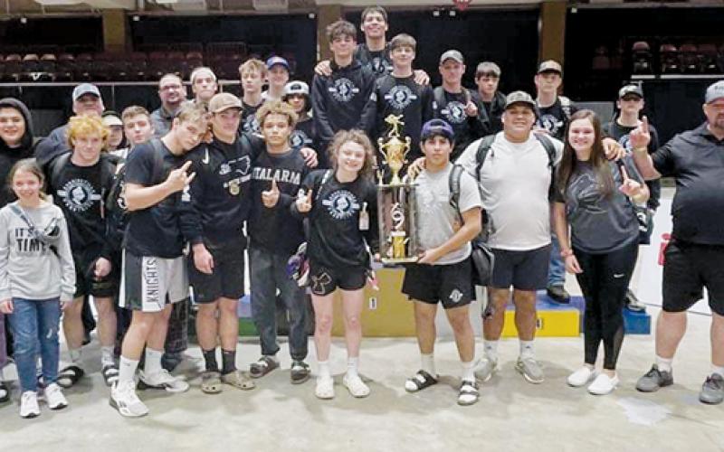 Members of the Robbinsville wrestling program pose with the 2021 Great Smoky Mountain Grapple tournament championship after Saturday's triumph in Asheville. The Knights have won two tournaments in a row. Photo courtesy of Susan Crowe/Contributing Photographer
